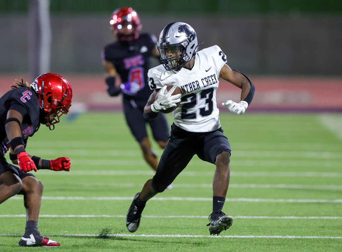 Frisco Panther Creek senior running back Charles Bell evades a defender in a win over Dallas Carter in October.